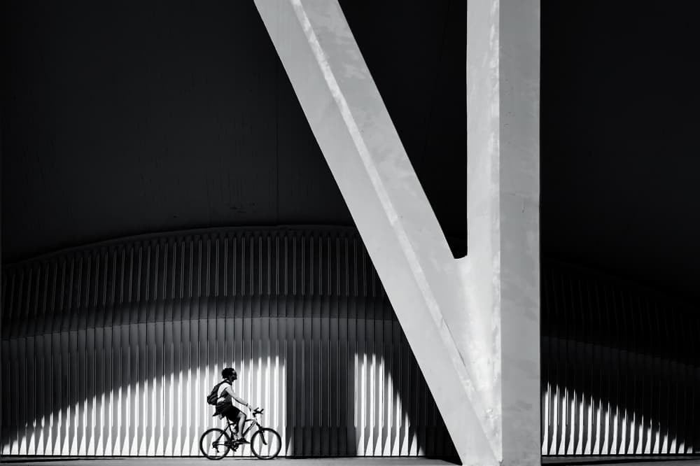 Urban Cyclist Geometric Shadows by Gerard Jonkman — canvas wall art