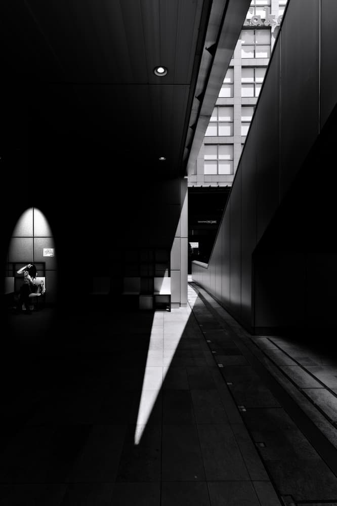 Solitary Figure in Urban Light by moucorn — canvas wall art
