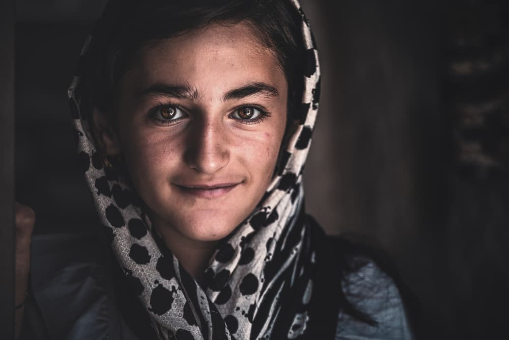 Young Girl Gentle Smile by Marco Tagliarino — canvas wall art