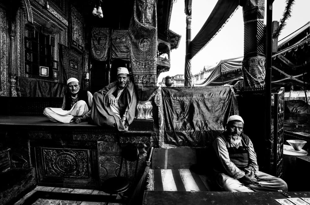 Elders in a Bazaar by Joxe Inazio Kuesta Garmendia — canvas wall art