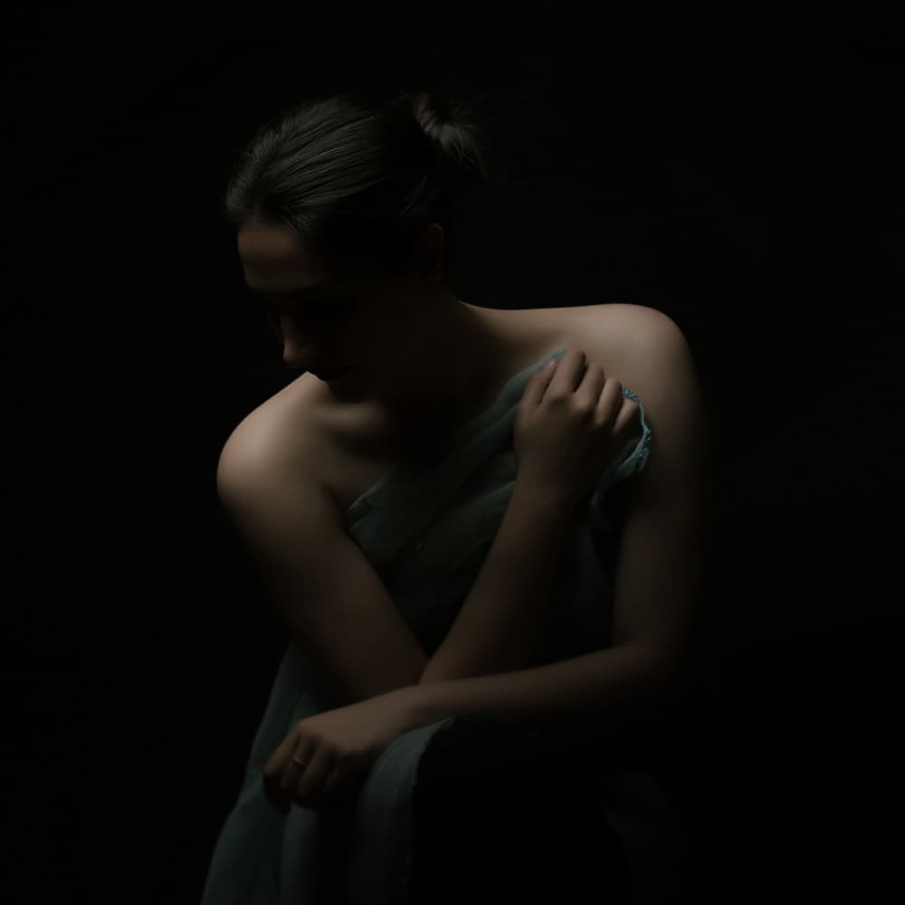 Pensive Woman in Shadow by Moein Hasheminasab — canvas wall art