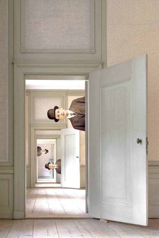 Man Peeking Endless Doors by Marja van den Hurk — canvas wall art