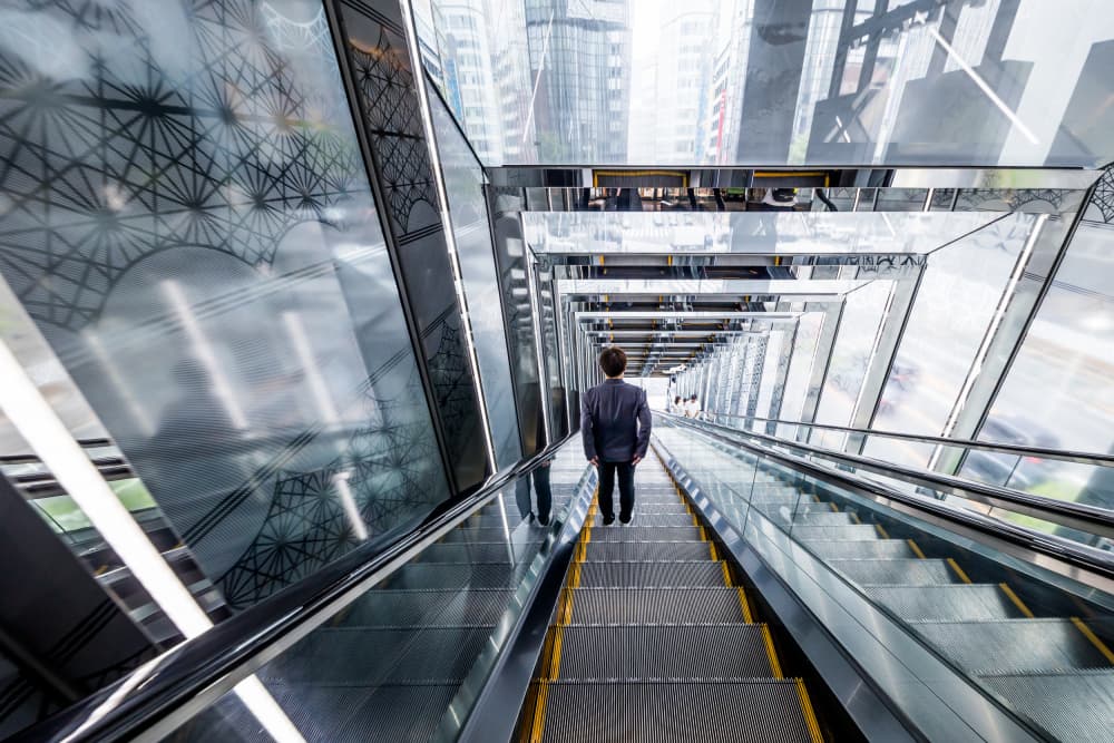 Man on Urban Escalator by Michiko Ôtomo — canvas wall art