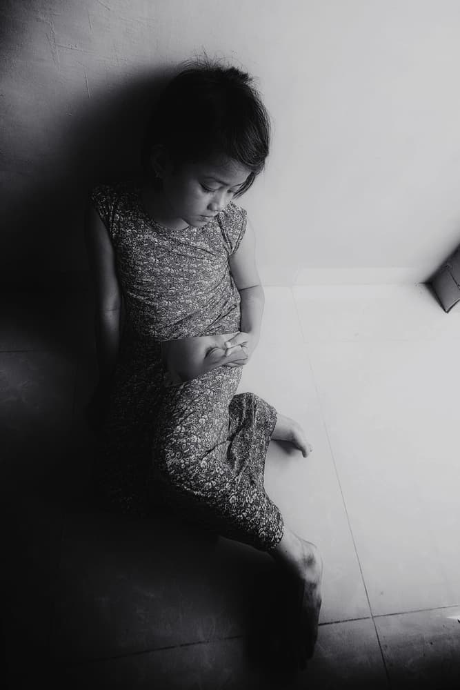 Pensive Girl Seated by Andi Halil — canvas wall art