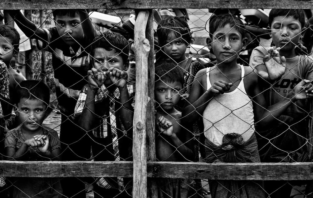 Young Faces Through Wire by Joxe Inazio Kuesta Garmendia — canvas wall art