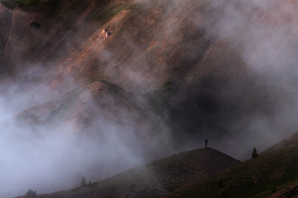 Hiker on a Misty Peak by Uschi Hermann — canvas wall art