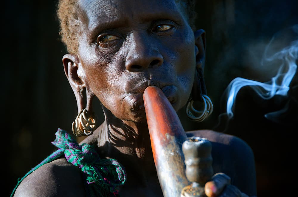 African Elder Smoking Pipe by Trevor Cole — canvas wall art