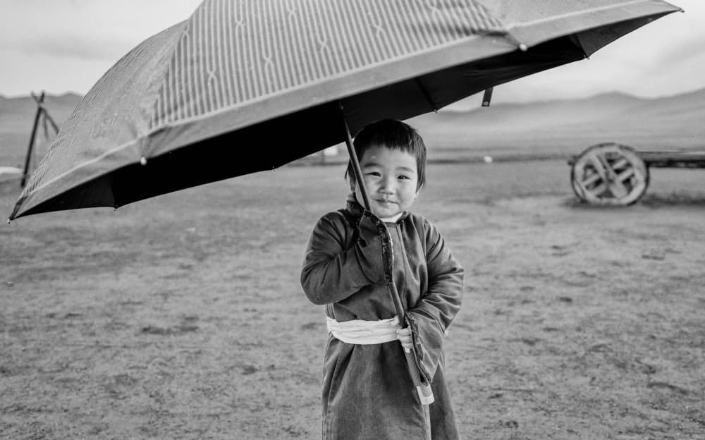 Happy Child with Umbrella by ADIREK M — canvas wall art