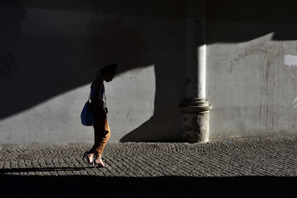 Shadowed Street Walker by Elena Raceala — canvas wall art