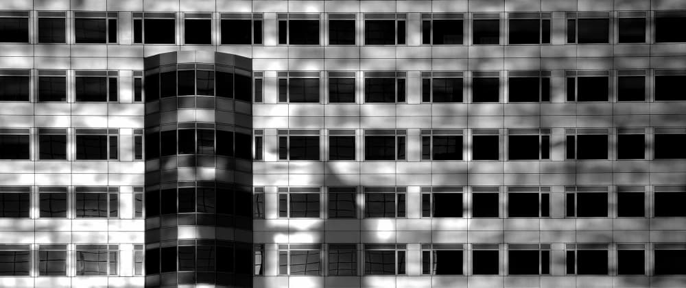 Shadows On Urban Facade by Huib Limberg — canvas wall art