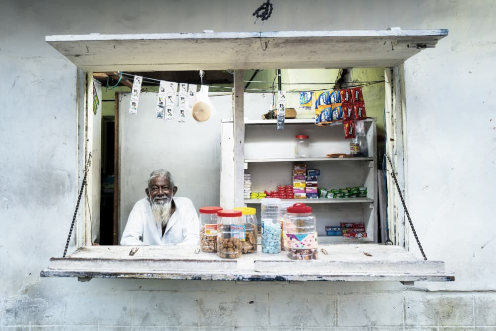 Kiosk Owner by Martin Steeb — canvas wall art