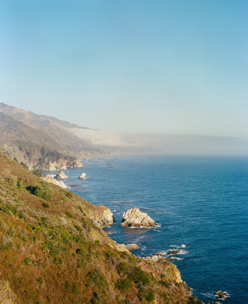 Misty Ocean Mountains by Bethany Young — canvas wall art