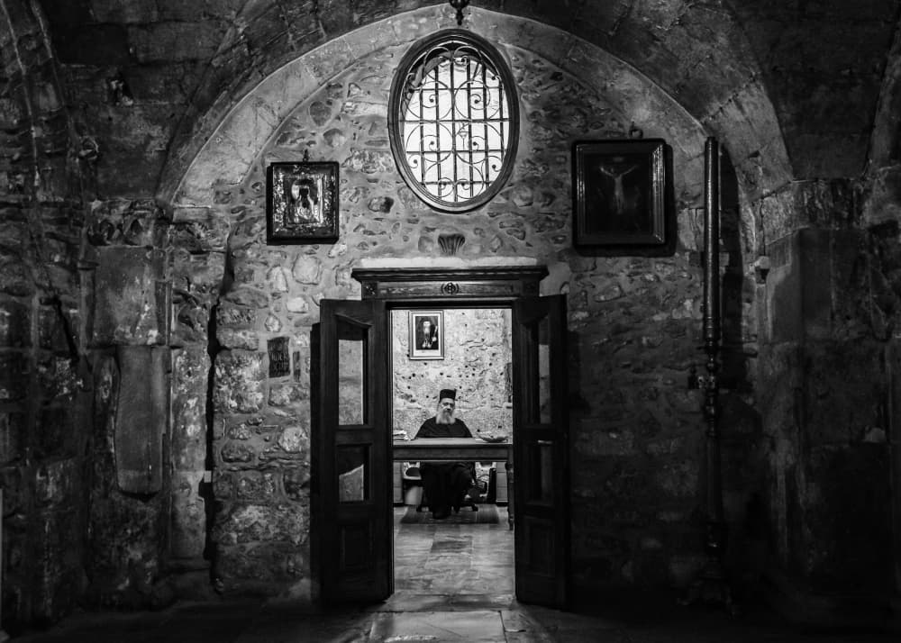 Monk In Ancient Chapel by Joshua Raif — canvas wall art