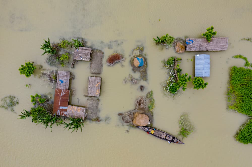 Flooded Village Homes by Azim Khan Ronnie — canvas wall art