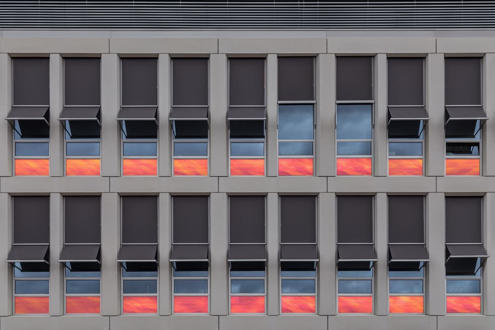 Urban Sunset Reflections by Theo Luycx — canvas wall art