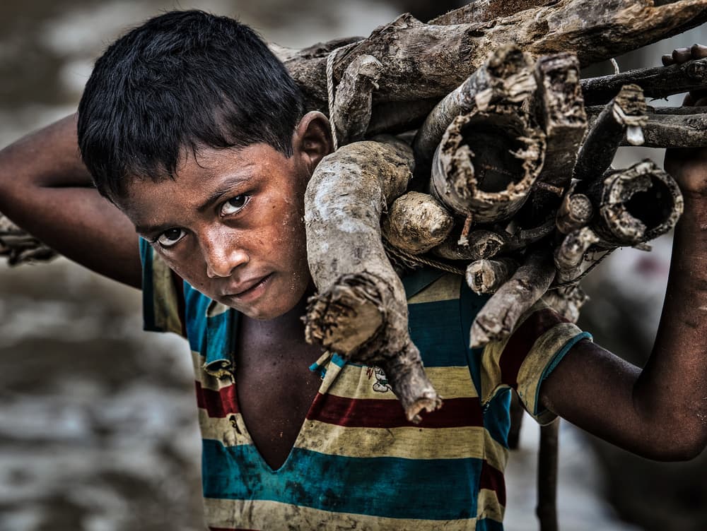 Young Boy's Burden by Joxe Inazio Kuesta Garmendia — canvas wall art