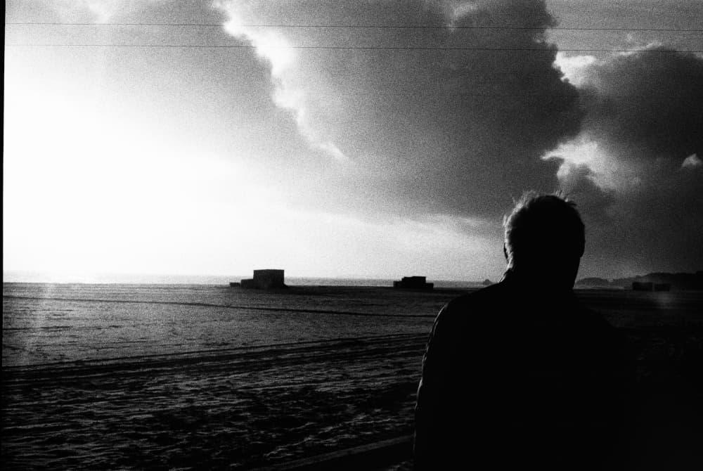 Solitary Figure Ocean View by Paulo Abrantes — canvas wall art