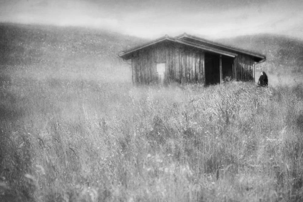 Solitary Figure Old Barn by Roswitha Schleicher-Schwarz — canvas wall art