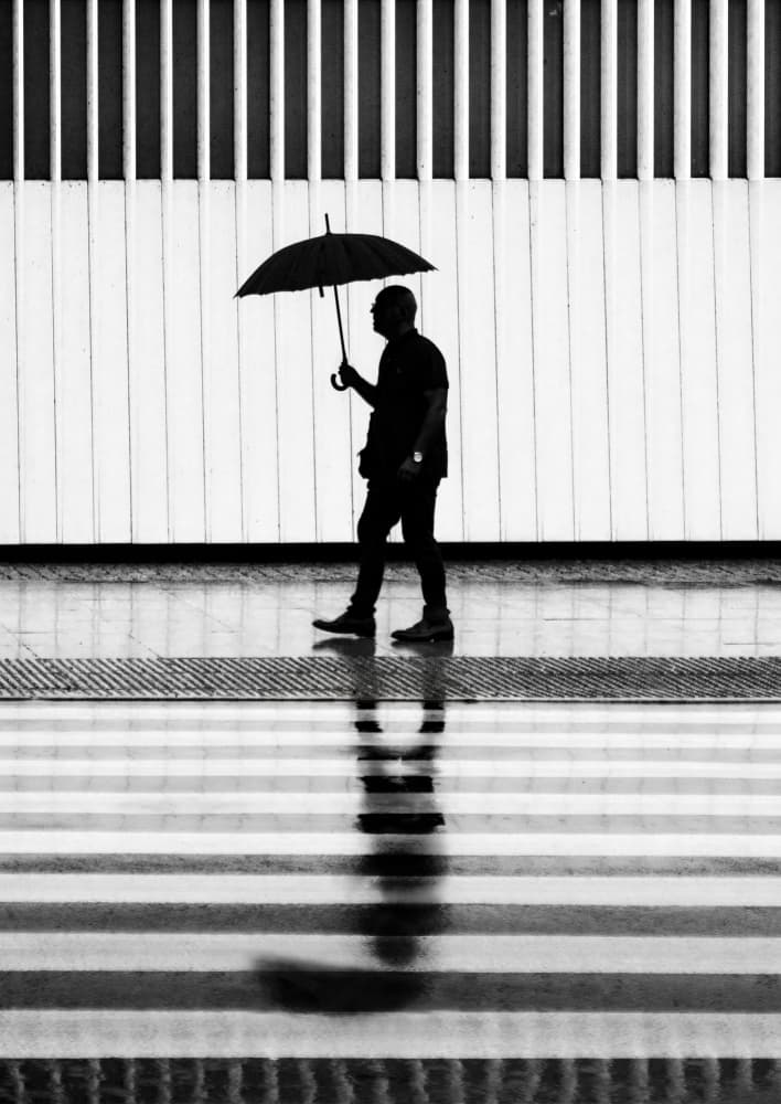 Umbrella Man Reflection by Anna Niemiec — canvas wall art