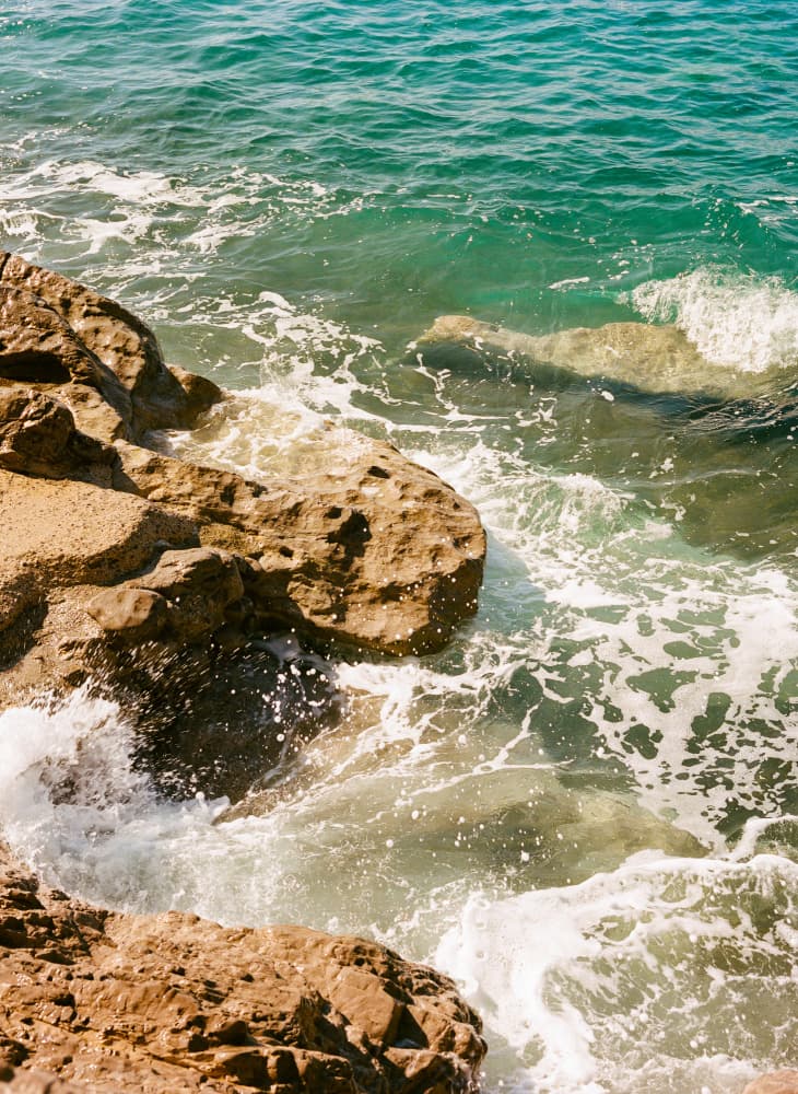 Turquoise Coastal Rocks by Bethany Young — canvas wall art