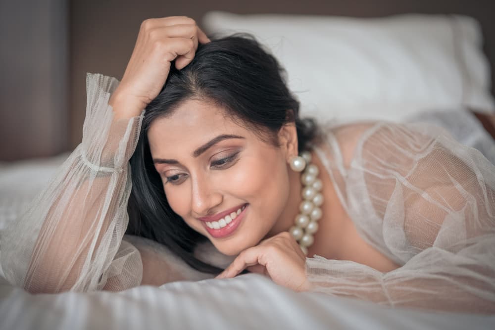 Smiling Woman in Pearls by HIRAK BHATTACHARJEE — canvas wall art