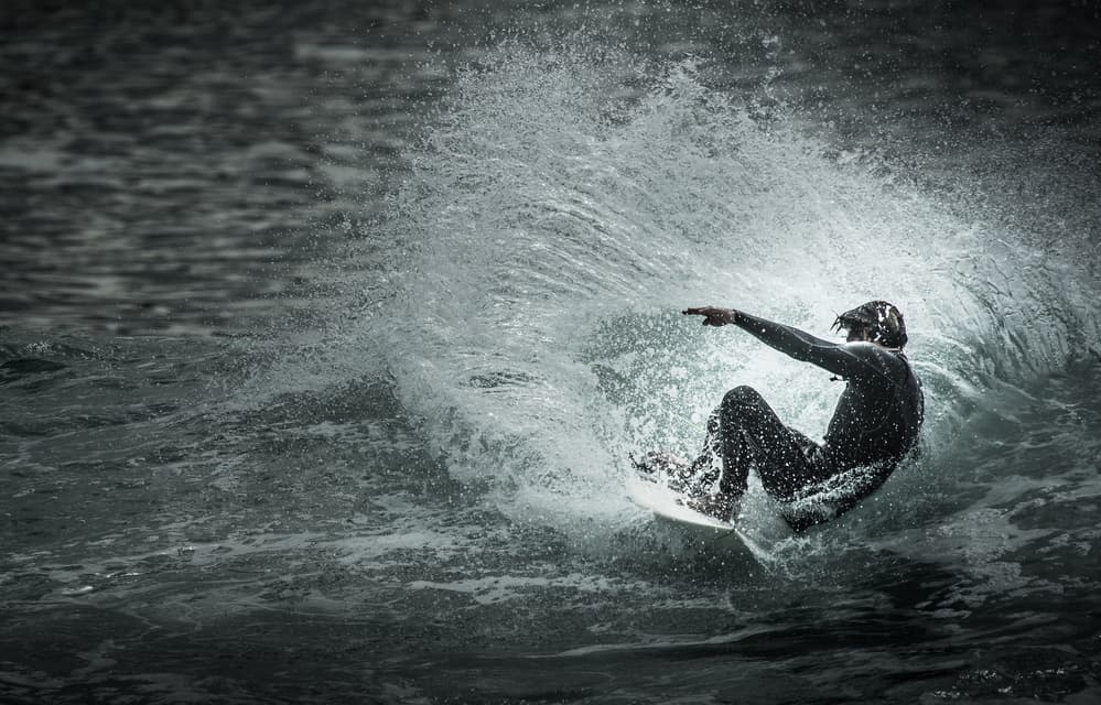 Surfer Rides Crashing Wave by Eric Verbiest — canvas wall art