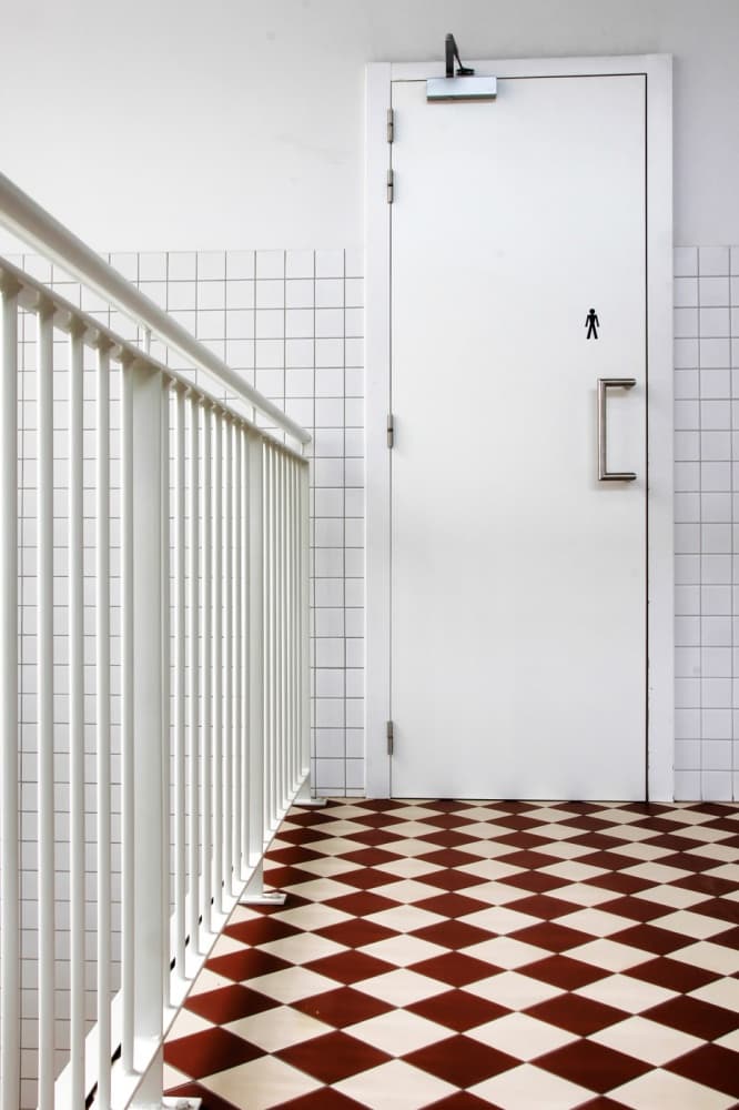 Checkerboard Hallway Door by Eric Mattheyses — canvas wall art