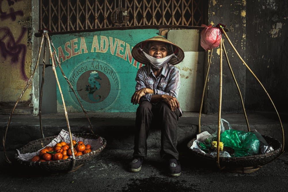 Smiling Vietnamese Vendor by Marco Tagliarino — canvas wall art