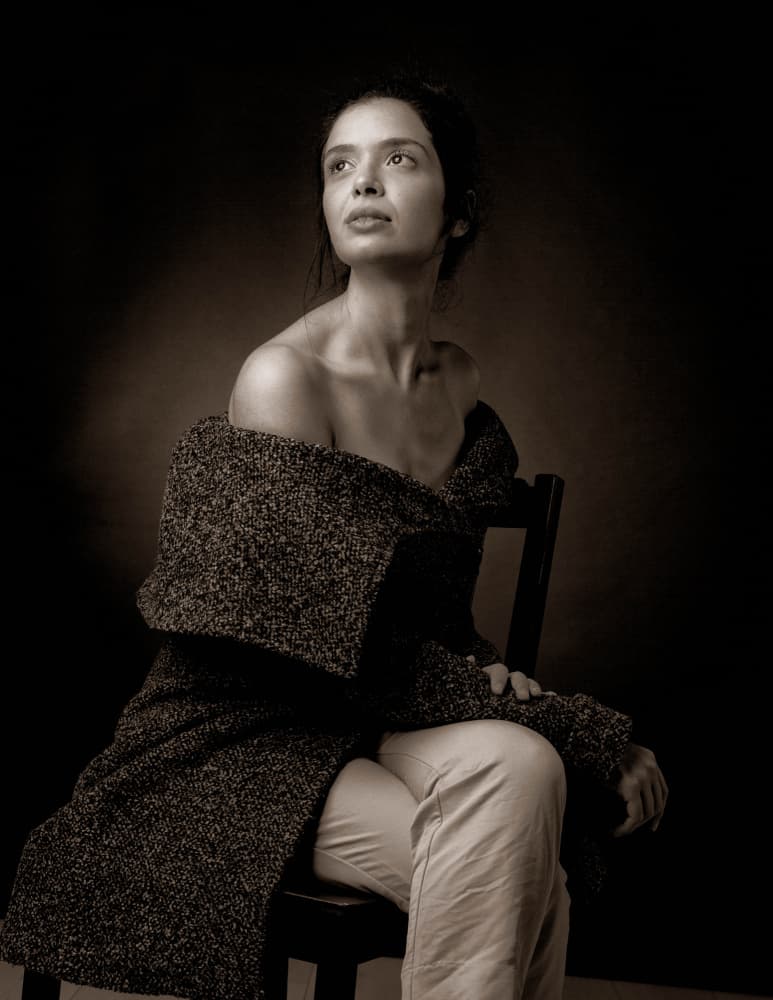 Pensive Woman Looking Up by Tali Stein — canvas wall art