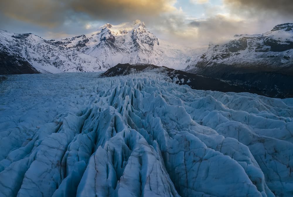 Glacier Under Dramatic Sky by David Martin Castan — canvas wall art