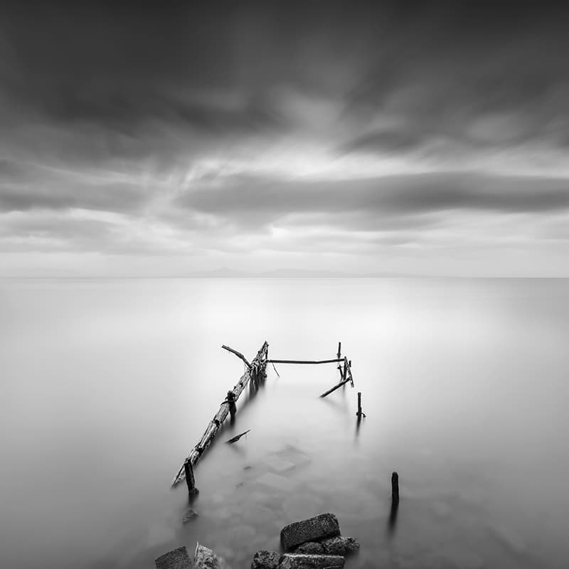 Moody Sea Pier by George Digalakis — canvas wall art