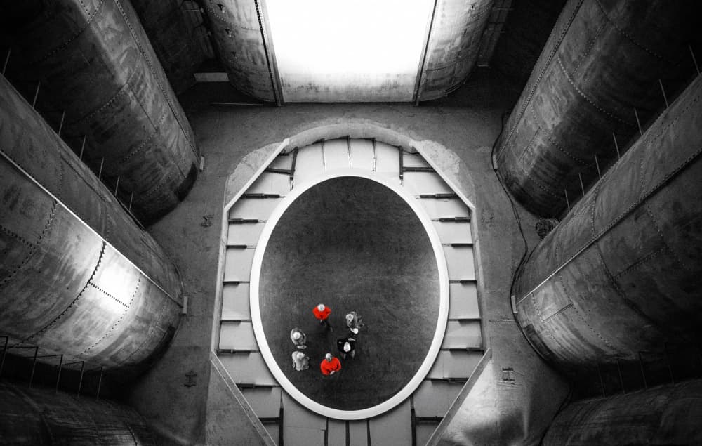 Red Figures Industrial Space by Roland M Schwerdtfeger — canvas wall art