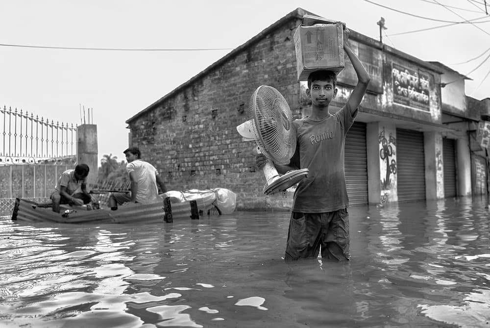 Man Wading Flood by Avishek Das — canvas wall art