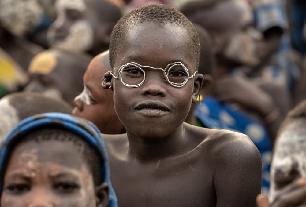 Child With Wire Glasses by Sarawut Intarob — canvas wall art