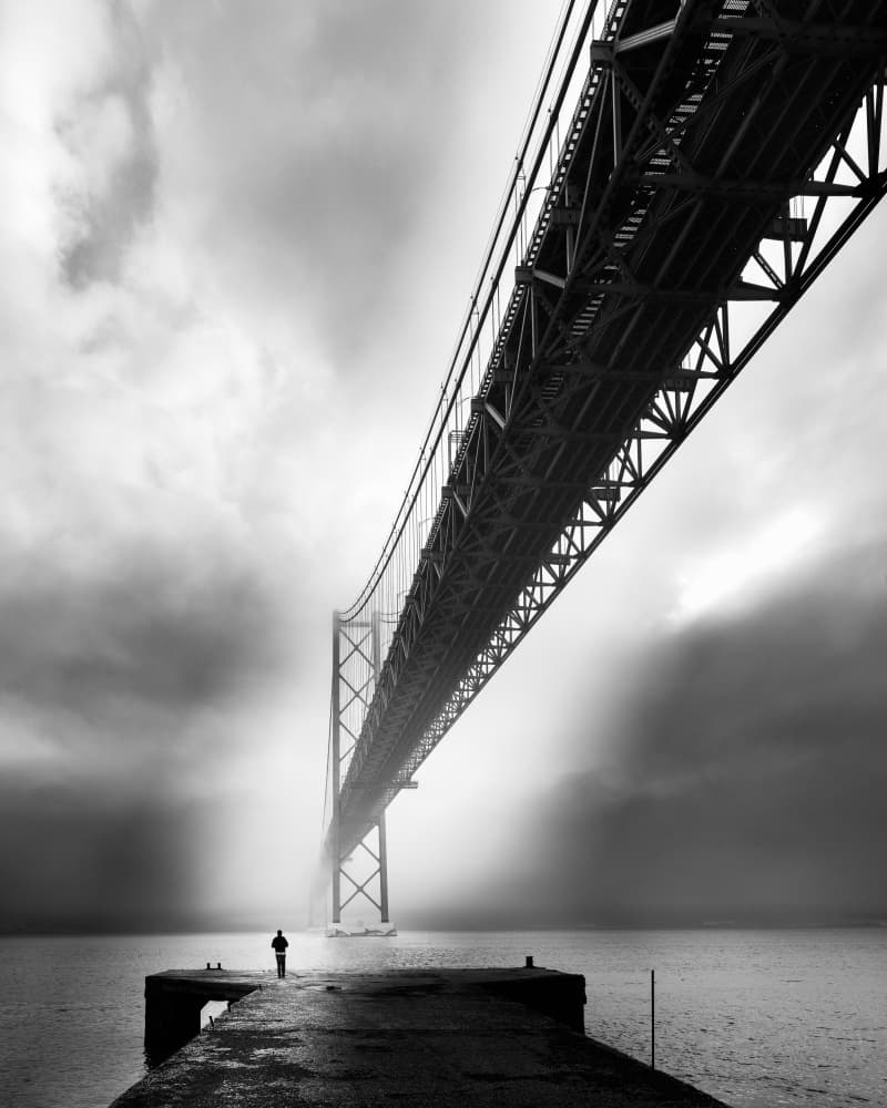 Lone Figure Misty Bridge by Olavo Azevedo — canvas wall art