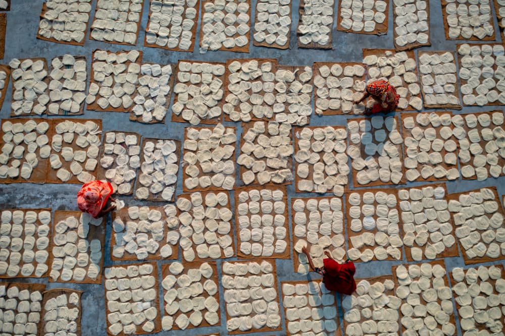 Drying Traditional Papads by Azim Khan Ronnie — canvas wall art