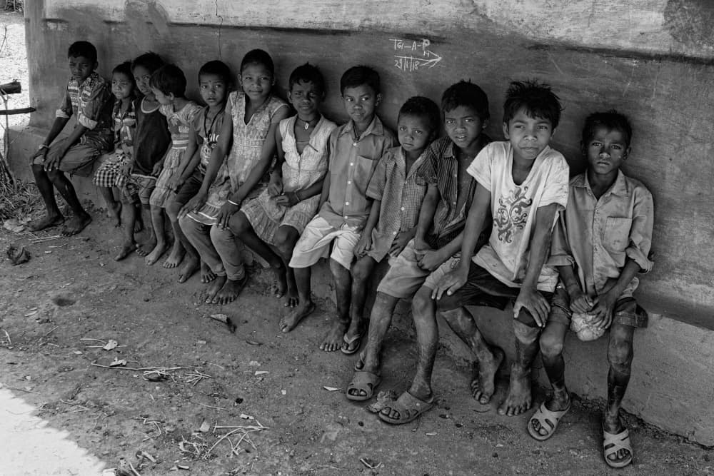 Village Boys Sitting by Shaibal Nandi — canvas wall art