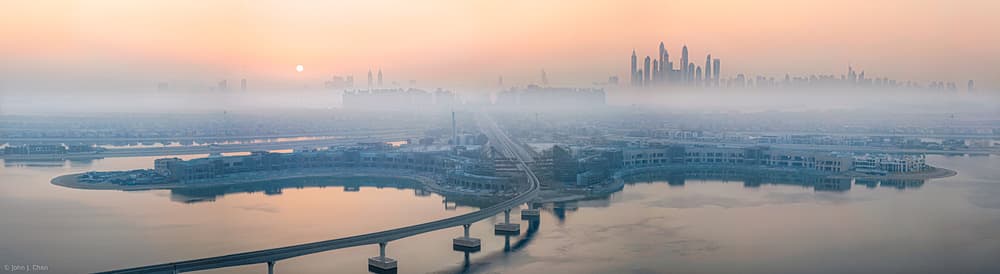 Misty City Sunrise by John J. Chen — canvas wall art