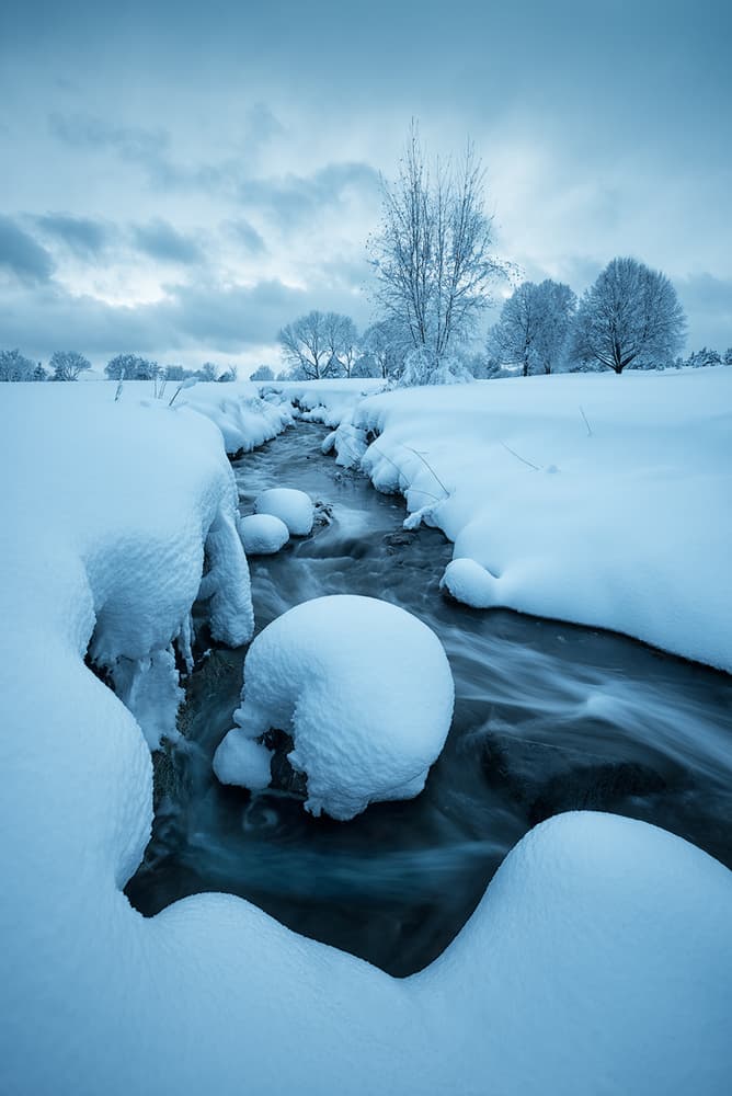 Serene Winter Stream by Mei Xu — canvas wall art