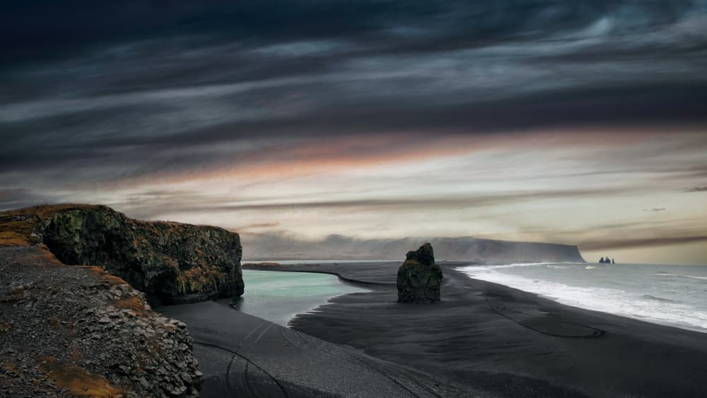 Moody Black Sand Beach by Mathilde Guillemot — canvas wall art