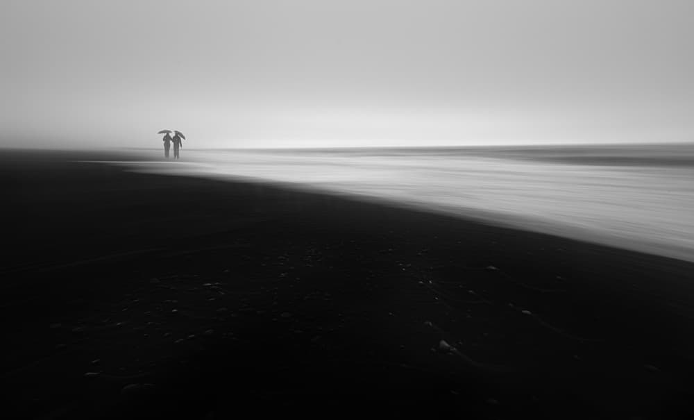 Couple On Dark Beach by Aidong Ning — canvas wall art