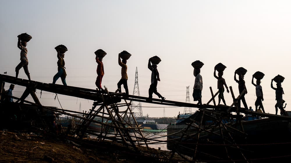 Working Silhouettes On Bridge by Marcel Rebro — canvas wall art