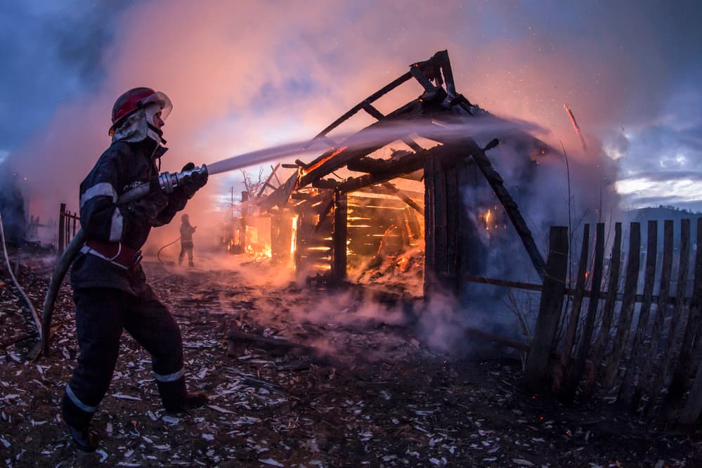 Firefighter Battles Burning House by Sveduneac Dorin Lucian — canvas wall art