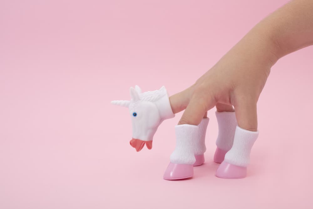 Pink Unicorn Hand by Julia Ramiro — canvas wall art