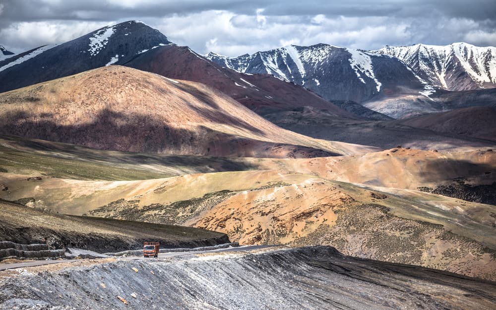 Truck on Mountain Road by Marco Tagliarino — canvas wall art