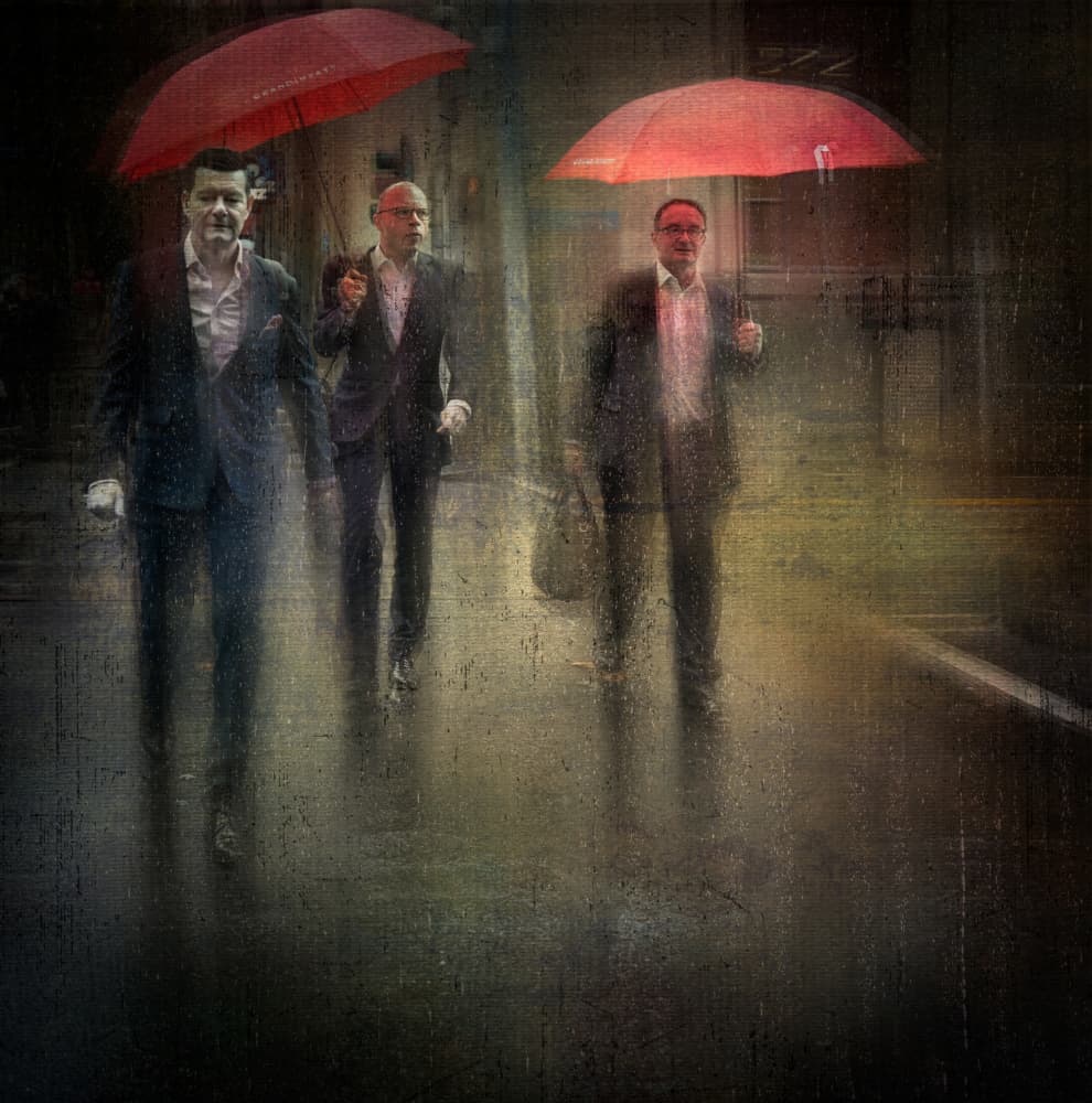 Men With Red Umbrellas by David Chiodo — canvas wall art