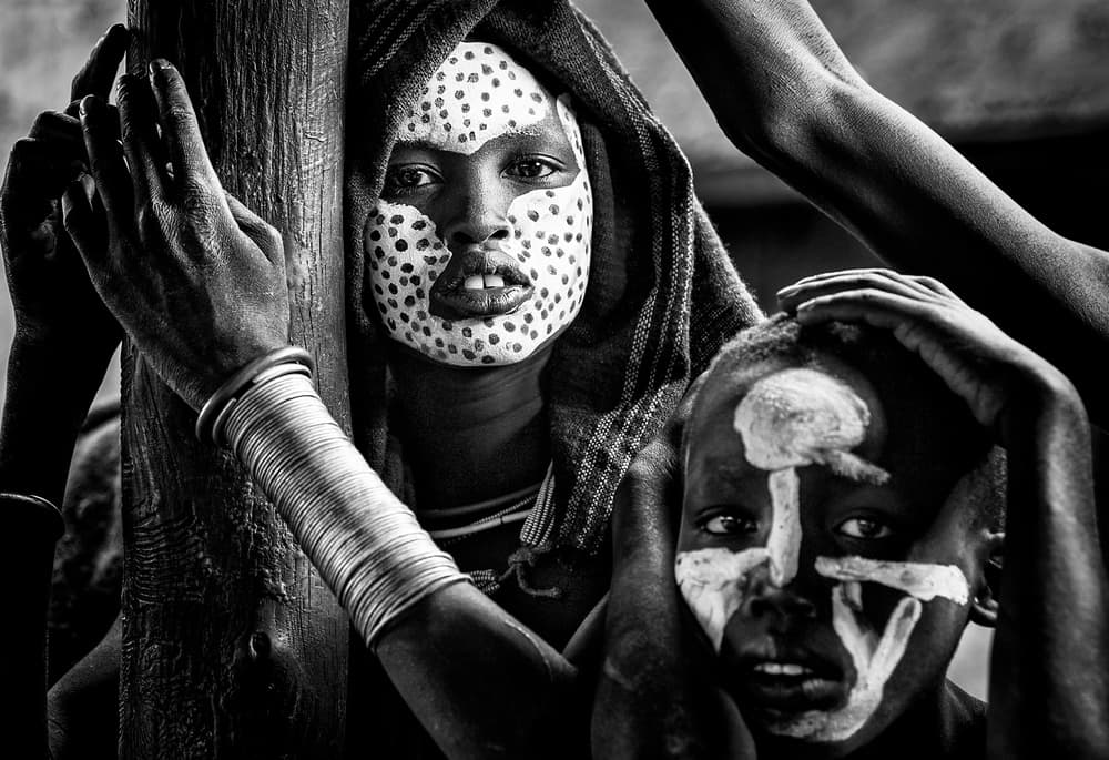 African Painted Faces by Joxe Inazio Kuesta Garmendia — canvas wall art