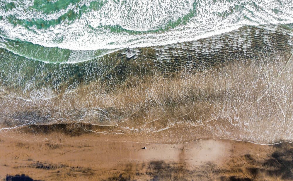 Ocean Waves on Sand by Martin Blahák — canvas wall art