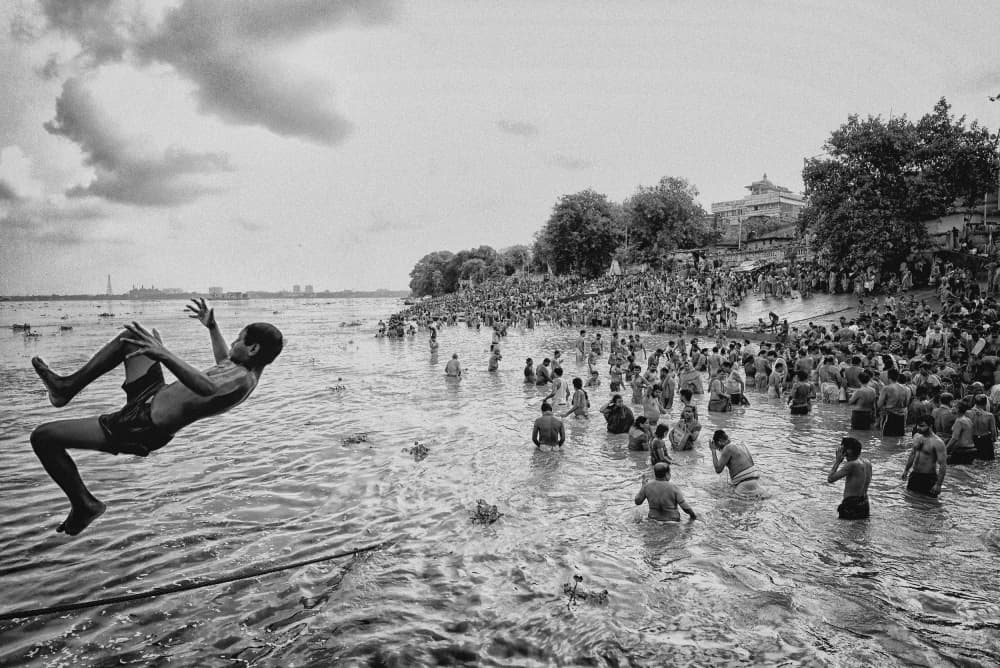 Boy Jumps River Ganges by Avishek Das — canvas wall art