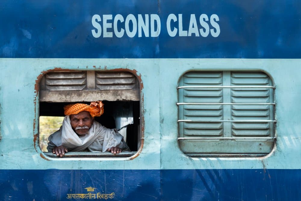Indian Man in Train Window by Emel Sefer — canvas wall art